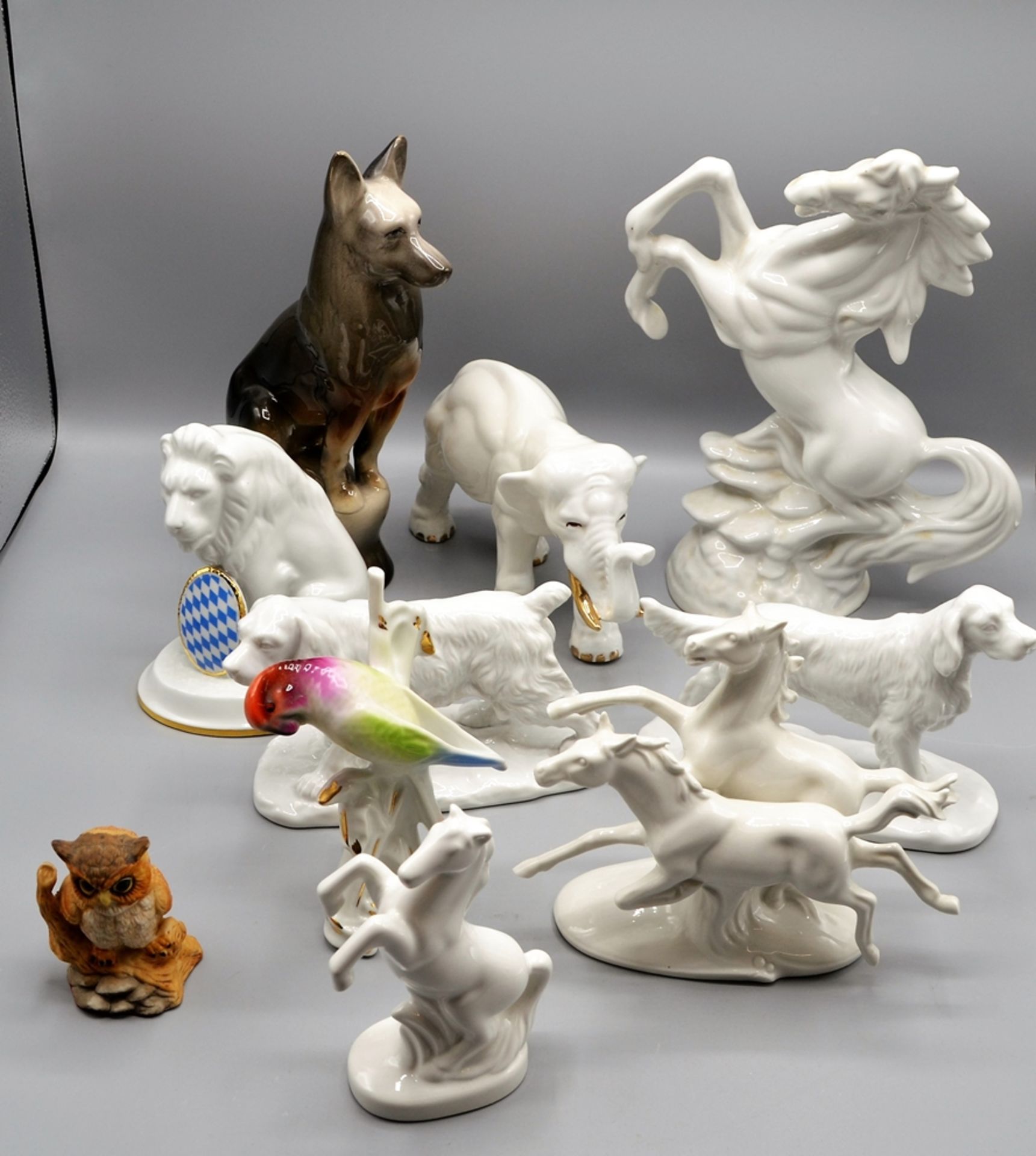 Porzellanfiguren Hunde Pferde Elefant Löwe Papagei etc. 10 St.