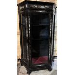 A FRENCH EBONISED DISPLAY CABINET, inlaid with classical designs with glass fronted sides, raised on