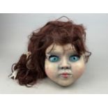 A DOLLS MASK FROM DERREN BROWN'S "GHOST TRAIN" RIDE AT THORPE PARK, 26cm in height. Media: https://