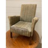 A children's easy armchair on oak legs