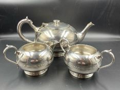 An Art Deco style tea pot, sugar bowl and milk jug