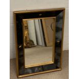 A gilt and mirrored frame wall mirror with stars to side (66cm x 48cm)