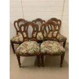 A set of five upholstered, mahogany dining chairs