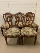 A set of five upholstered, mahogany dining chairs