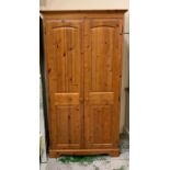 A pine double wardrobe with long mirror to inside door