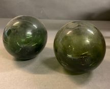 Two green spheres fishing floats