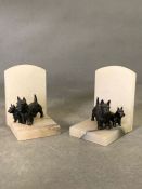 A pair of marble bookends with Scotty Dog Figures.