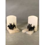 A pair of marble bookends with Scotty Dog Figures.