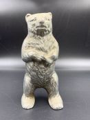 A Vintage cast iron moneybox in the form of a Bear.