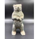 A Vintage cast iron moneybox in the form of a Bear.