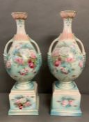 A Pair of Porcelain vases, decorated with floral detail on pedestals (57 cm H with base and 43 cm