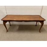 A long coffee table with scrolled/waved rim on cabriole legs (H43cm W113cm D42cm)