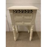 A painted bedside with two drawers