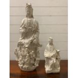 A Dehua white porcelain statue with a smaller Dehua