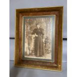 A vintage photography of a lady standing, framed and glazed (70cm x 55cm).