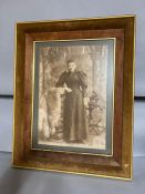 A vintage photography of a lady standing, framed and glazed (70cm x 55cm).