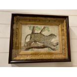 A watercolour of a Leopard standing in trees. In a mahogany and gilt frame