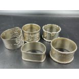 Five various silver napkin rings, various hallmarks and makers (Total Weight 106g)