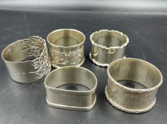 Five various silver napkin rings, various hallmarks and makers (Total Weight 106g)