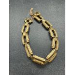 A 9ct gold bracelet with safety chain (Total Weight 13.2g)