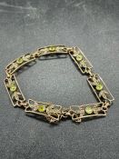 A 9ct gold bracelet with peridot and seed pearls (Total Weight 9.6g)