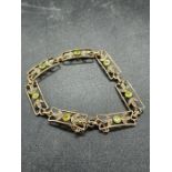 A 9ct gold bracelet with peridot and seed pearls (Total Weight 9.6g)