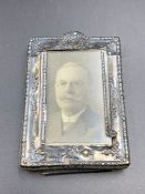 A miniature silver picture frame (6.5cm x 4.5cm)