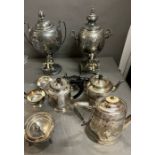 A selection of white metal teapots, samovars,etc