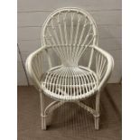 A white painted bamboo chair