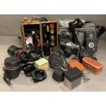 A selection of lens by Vivitat Tamaron along with other photographic accessories