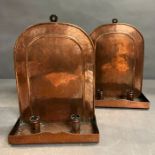 A pair of Arts and Craft copper wall sconces etched with cupid and scrolls 31cm x 24cm.