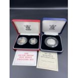 A 1992-1993 silver proof fifty pence coin and a 1990 silver proof five pence two coin set