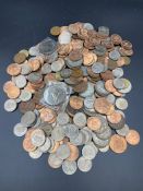 A selection of UK coins, different denominations, years and conditions.