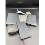 Concorde memorabilia: to include wallet, notebook, pen, address book, mirror, cuff link holder and a