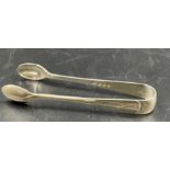 A pair of 1922 silver sugar nips by Elkington & Co