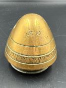 A brass shell case head