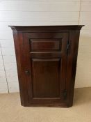 A mahogany wall hanging corner unit