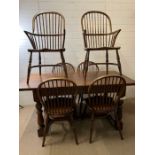 An English oak refectory table along with four stick back Windsor chairs and two elbow Windsor stick