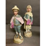 Two Bisque figures, boy and girl