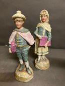 Two Bisque figures, boy and girl