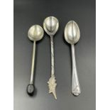 Three various silver teaspoons.