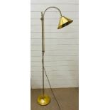 A brass standard lamp, cone shape and adjustable height