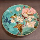 A Minton Art Pottery Studio earthenware charger, 1871 - 1875 painted with roses and blossoms (