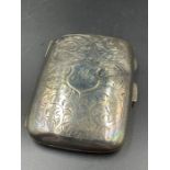 A silver cigarette case by HM with Birmingham hallmark