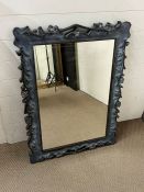 A carved wall mirror (70cm x 98cm)