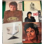 Three Michael Jackson records and three Beatles records