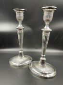 A pair of silver candlesticks by C J Vander Ltd, and hallmarked for Sheffield 1996 (29cm H)