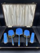 A cased silver and enamel dressing table set in blue, bo marked David Lyall Jeweller Nairobi,