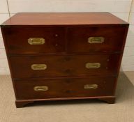 A campaign chest, two drawers over two (H77cm W87cm D45cm)