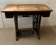 A vintage Cleveland sewing machine table